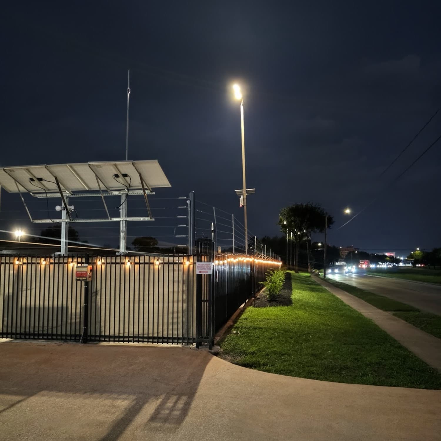Electric-fenced, solar-powered, well-lit perimeter around the Hobby Airport Parking lot at night