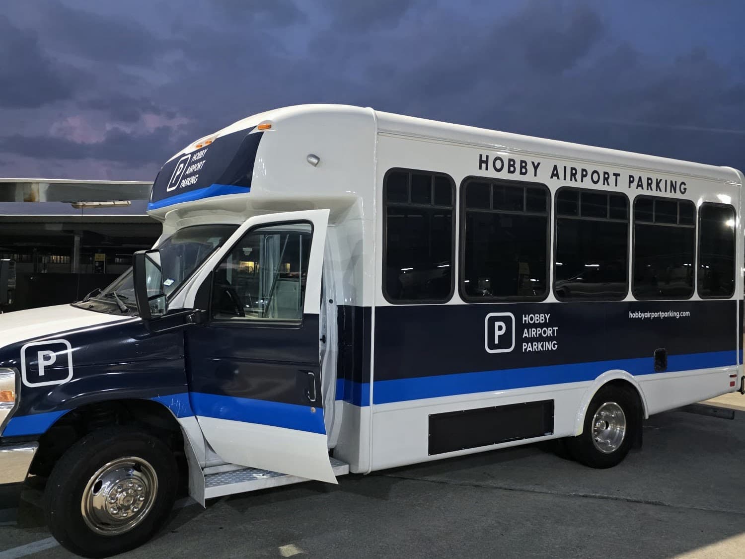 Branded Hobby Airport Parking shuttle bus that runs to the HOU terminal 24/7